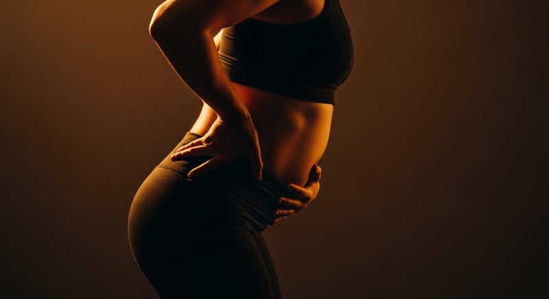 Editorial side-profile photograph of an anonymous figure showing an exaggerated lower-back arch with the pelvis tipped forward